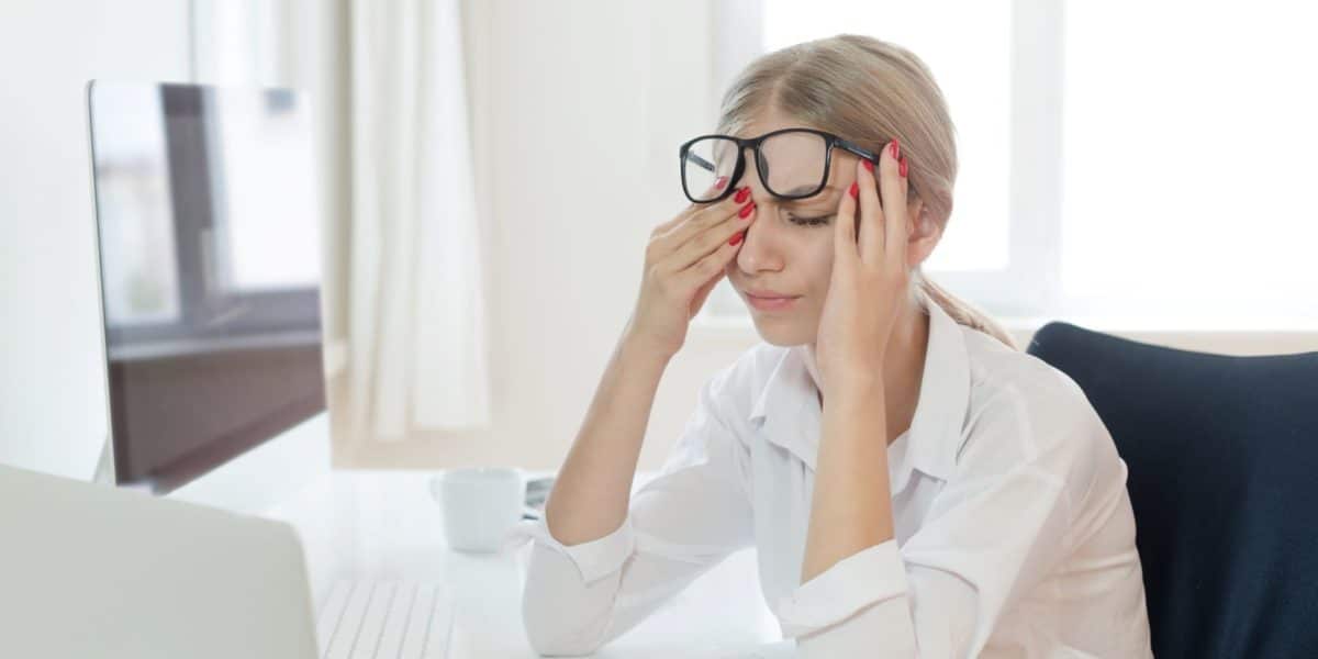 woman wearing glasses to treat astigmatism