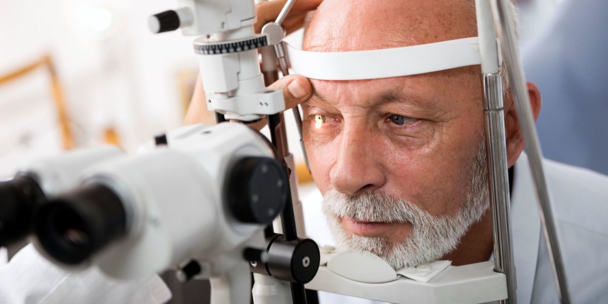 man getting comprehensive eye exam to check for glaucoma