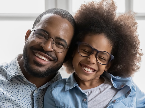 Father and daughter wearing eye glasses